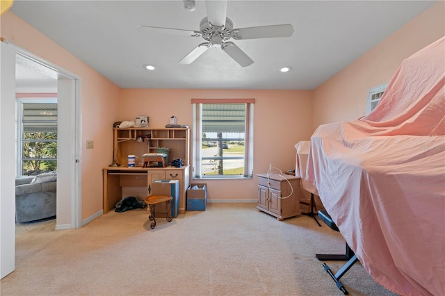 carpeted bedroom featuring ceiling fan