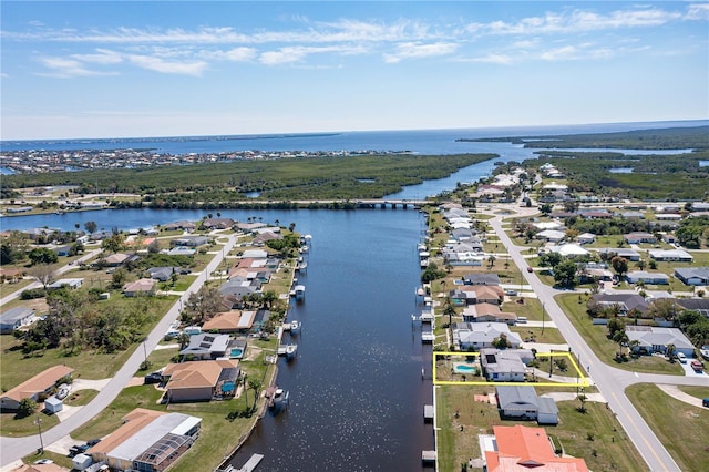 drone / aerial view featuring a water view