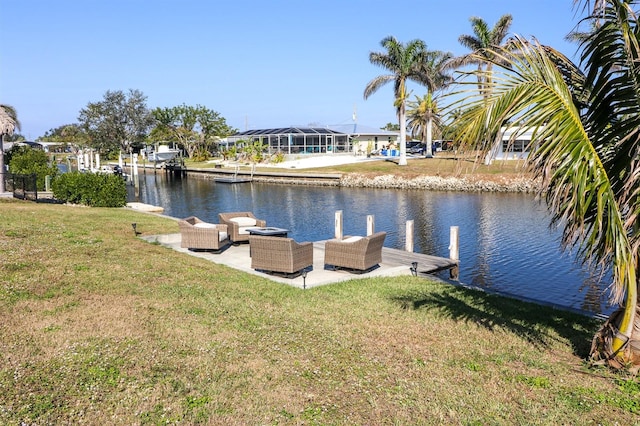 dock area with a yard, a water view, and an outdoor hangout area