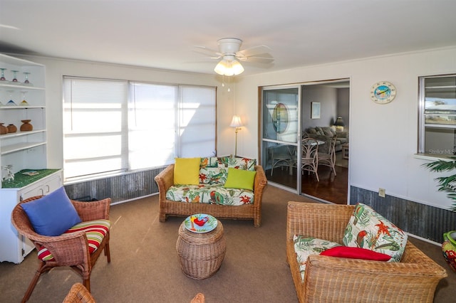 interior space featuring ceiling fan and carpet flooring