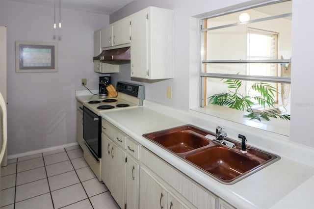 kitchen featuring sink, white cabinets, white electric range, and light tile patterned flooring