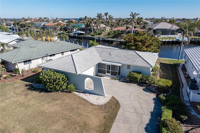 birds eye view of property with a water view