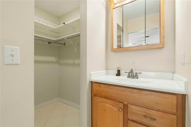 bathroom with tile patterned flooring and vanity