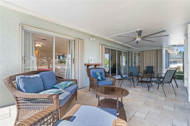 sunroom with ceiling fan