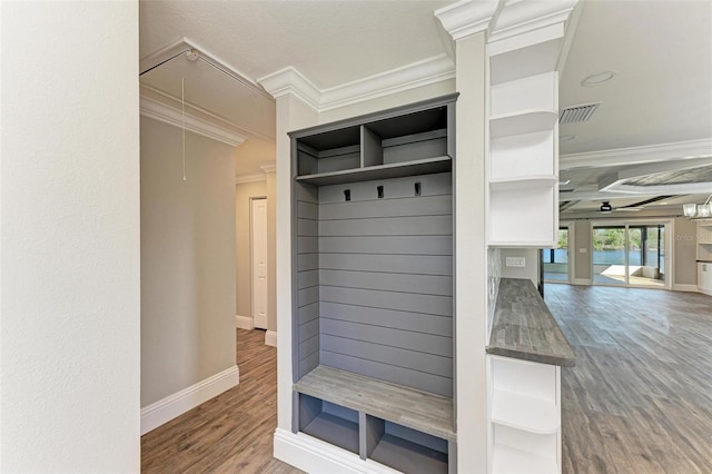 mudroom featuring ceiling fan, crown molding, and hardwood / wood-style floors