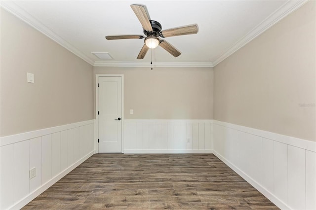 spare room with ceiling fan, ornamental molding, and dark hardwood / wood-style floors