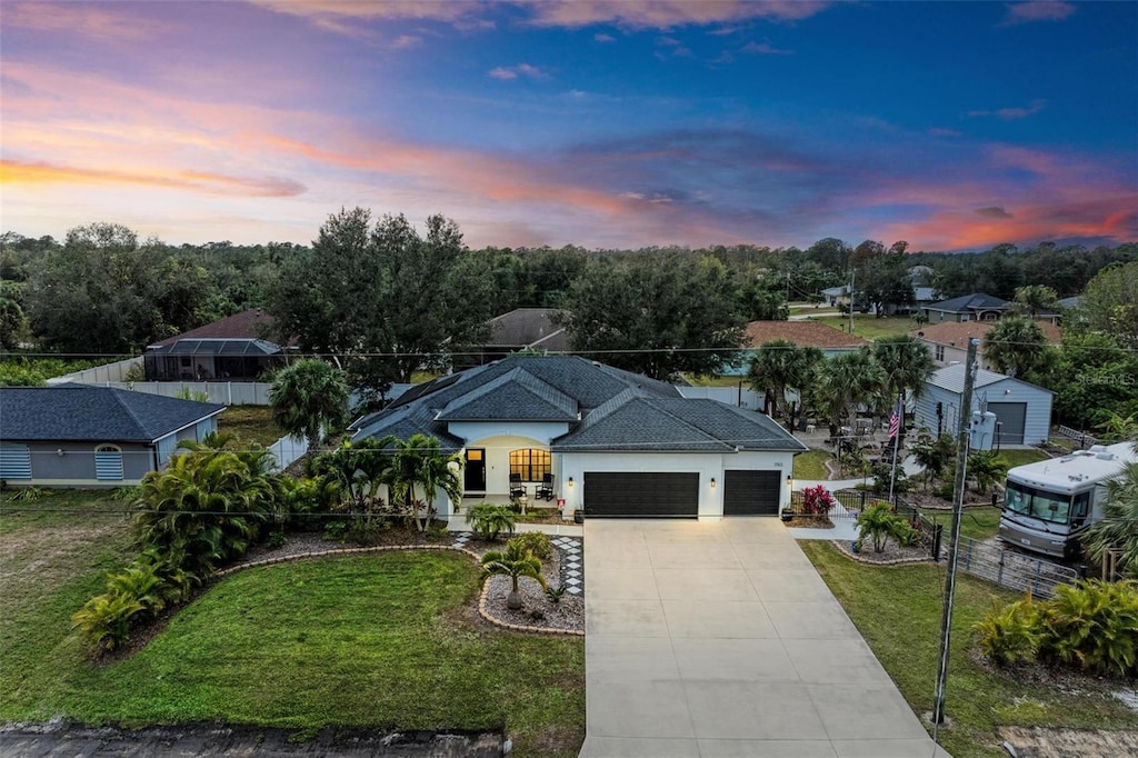 view of front of house with a lawn and a garage