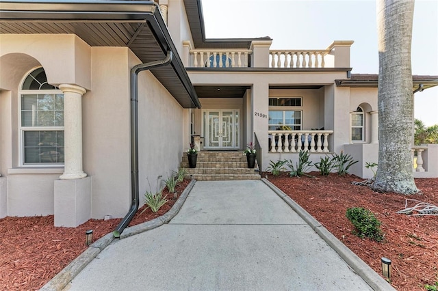 property entrance featuring french doors