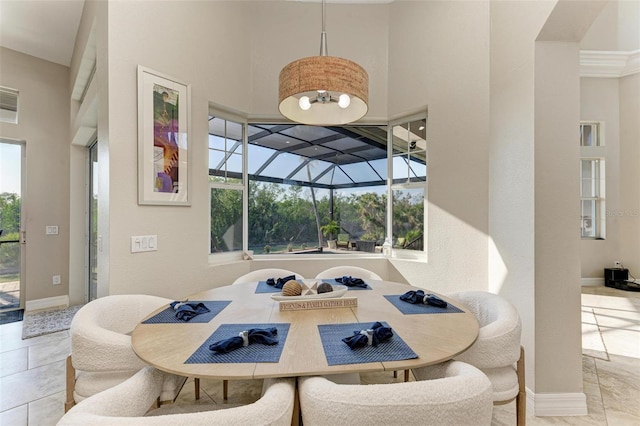 dining space featuring light tile patterned floors