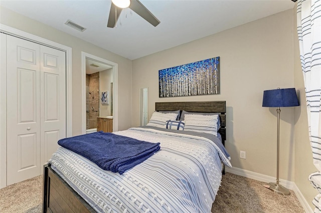 carpeted bedroom featuring ceiling fan, connected bathroom, and a closet