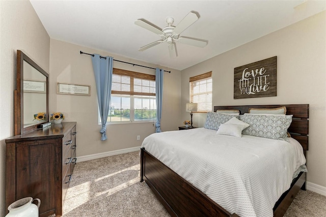 bedroom featuring ceiling fan and light colored carpet