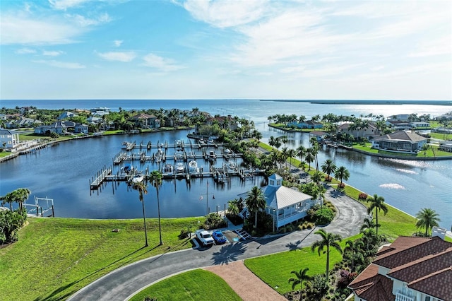 birds eye view of property with a water view