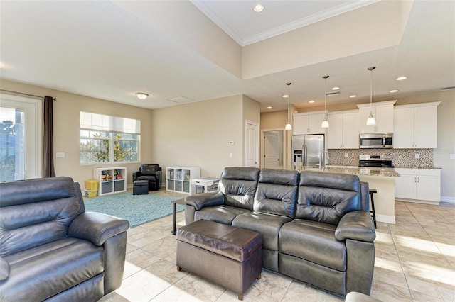 living room with ornamental molding and light tile patterned floors