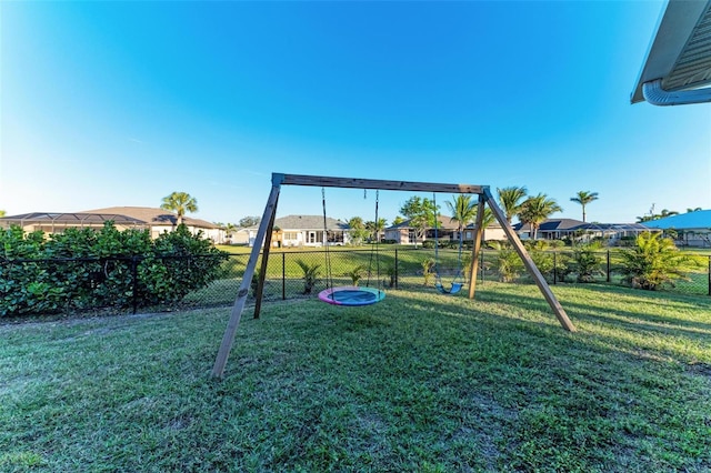 view of jungle gym with a lawn