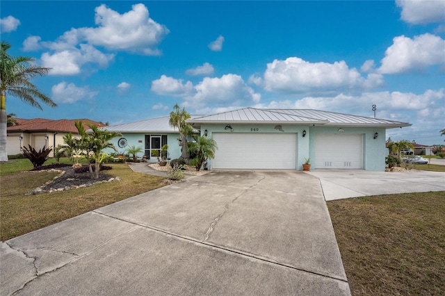 single story home with a front yard and a garage