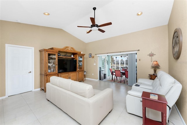 living room with ceiling fan and vaulted ceiling