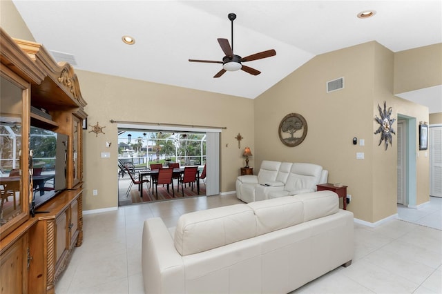 living room featuring ceiling fan and lofted ceiling