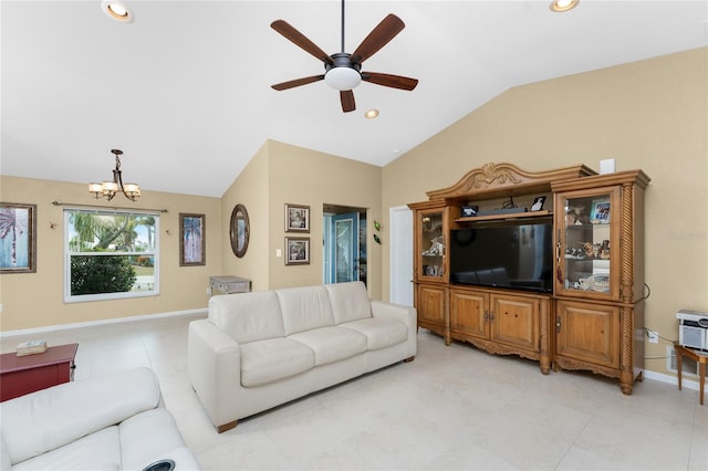 living room with ceiling fan with notable chandelier and vaulted ceiling