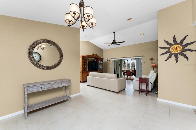 living room featuring ceiling fan with notable chandelier and lofted ceiling