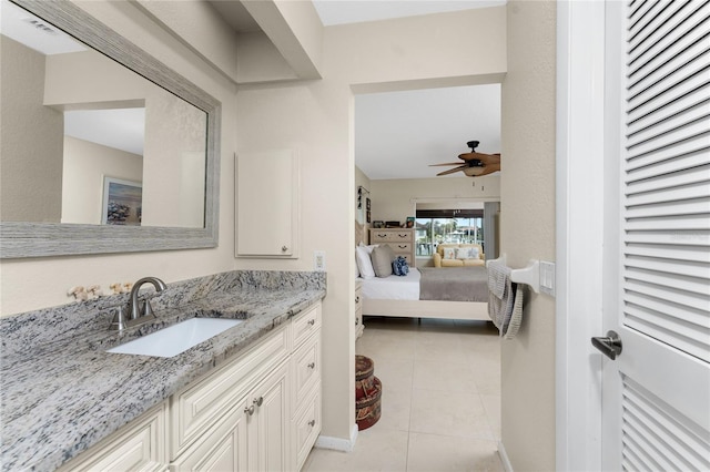 bathroom featuring ceiling fan, tile patterned flooring, and vanity