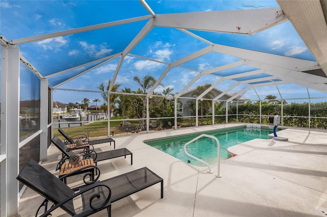 view of pool featuring a lanai and a patio