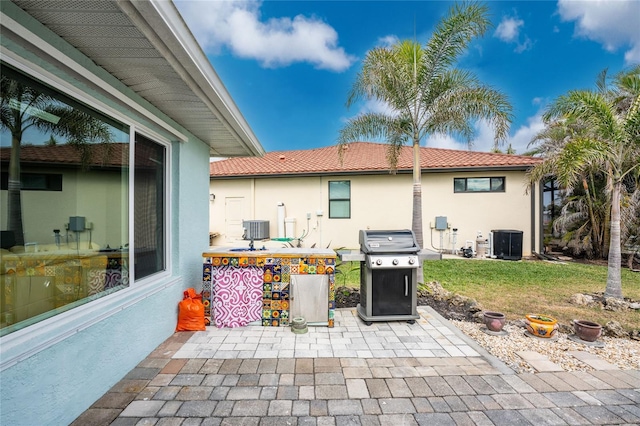 view of patio / terrace featuring central AC and area for grilling