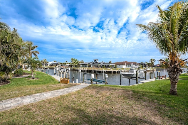 dock area featuring a water view and a yard