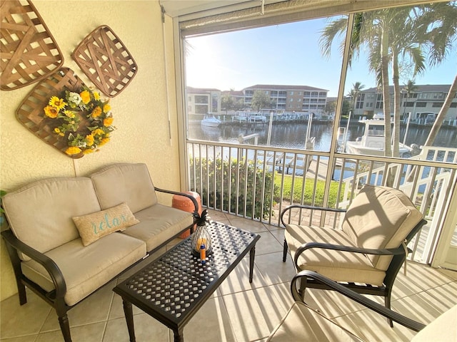 sunroom / solarium with a water view