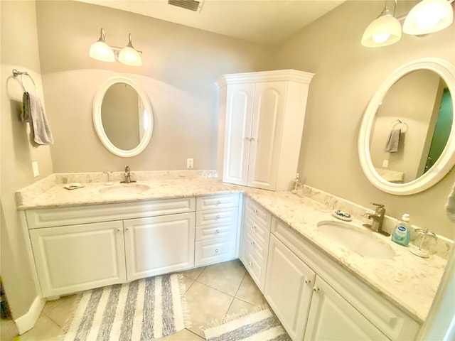 bathroom featuring tile patterned flooring and vanity