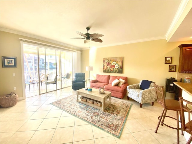 tiled living room featuring ornamental molding and ceiling fan