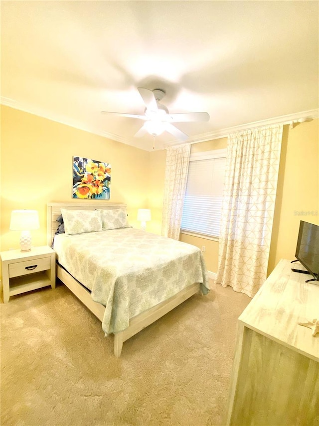 bedroom with light colored carpet, ornamental molding, and a ceiling fan