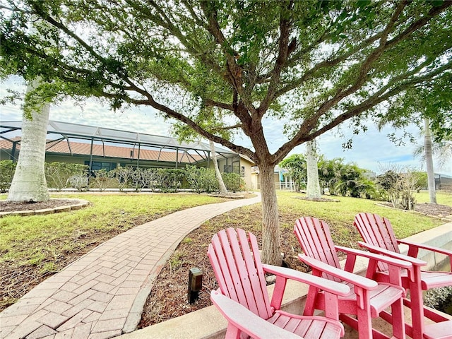 view of patio featuring a lanai