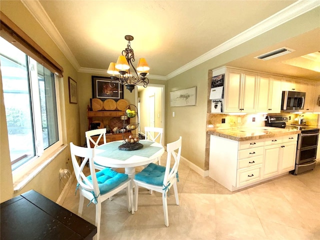 dining room with light tile patterned floors, crown molding, and a notable chandelier