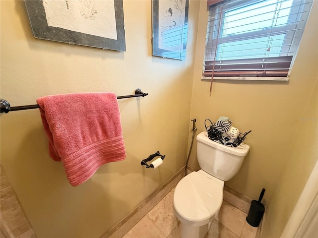 bathroom featuring tile patterned flooring and toilet