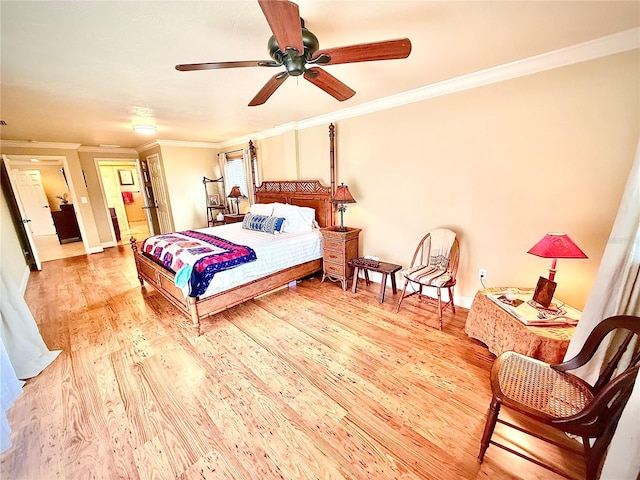 bedroom with ceiling fan, light wood-type flooring, and crown molding