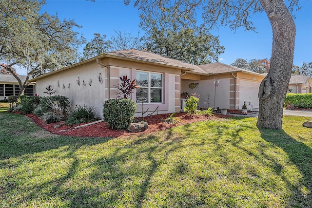 single story home with a garage and a front yard