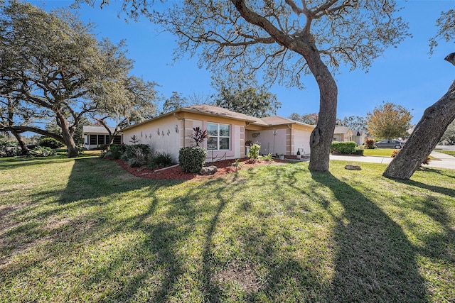 exterior space with a front lawn and a garage