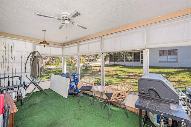 sunroom / solarium with ceiling fan