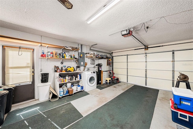 garage featuring washer / dryer, electric panel, and a garage door opener