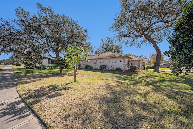 exterior space featuring a lawn