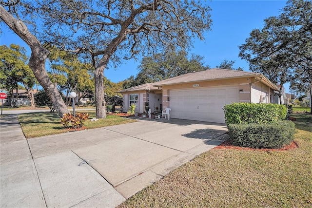 ranch-style home featuring a front lawn and a garage