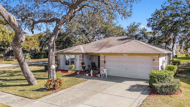 ranch-style house with a front yard and a garage