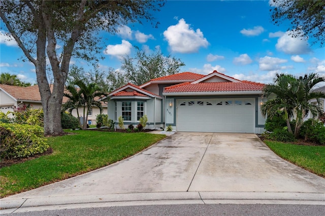 view of front facade featuring a garage and a front yard