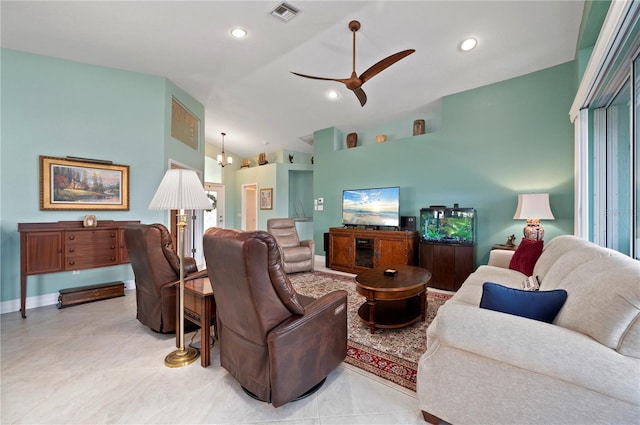 living room with ceiling fan with notable chandelier and high vaulted ceiling