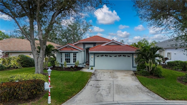 view of front facade featuring a garage and a front lawn