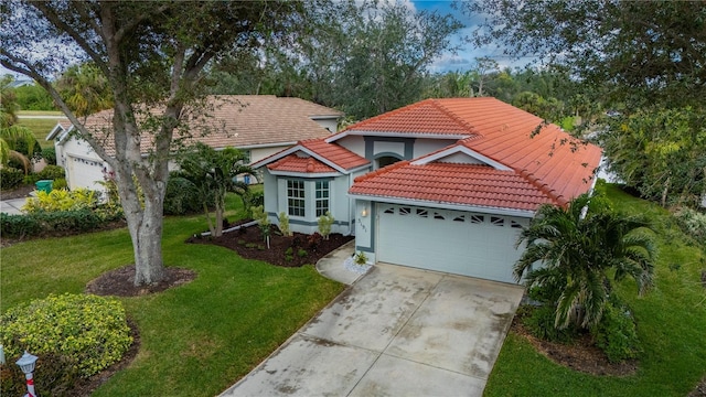 view of front of property with a garage and a front lawn