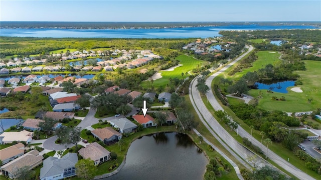 birds eye view of property with a water view