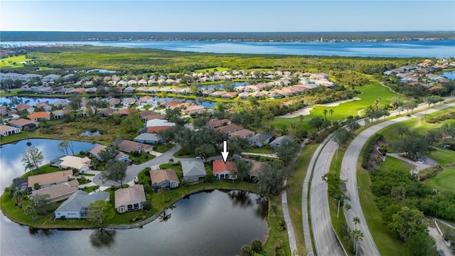 birds eye view of property with a water view