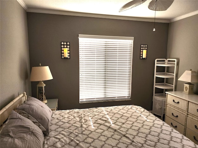 bedroom with ornamental molding and ceiling fan