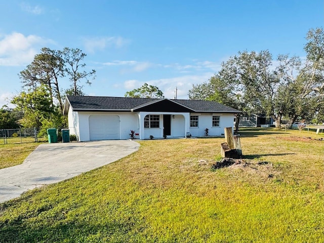 ranch-style home featuring a garage and a front lawn